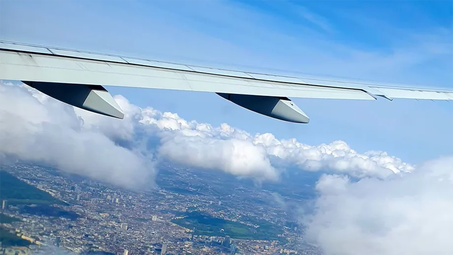 An airplane wing seen from sky